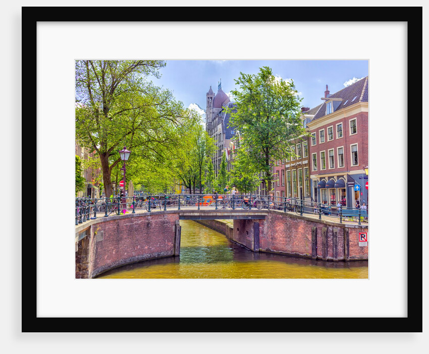 Canal through Amsterdam city by Assaf Frank